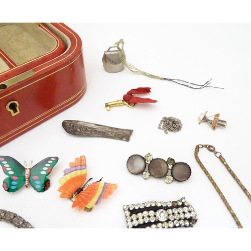 950 - A jewellery box containing assorted jewellery badges, pins, brooches, necklaces etc