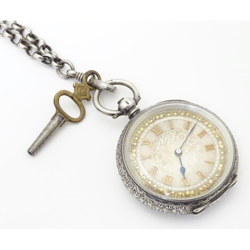 952 - A Continental silver cased pocket / fob watch the movement marked W & Co, Swiss made. Together with ... 