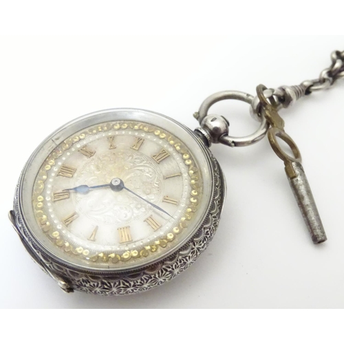 952 - A Continental silver cased pocket / fob watch the movement marked W & Co, Swiss made. Together with ... 