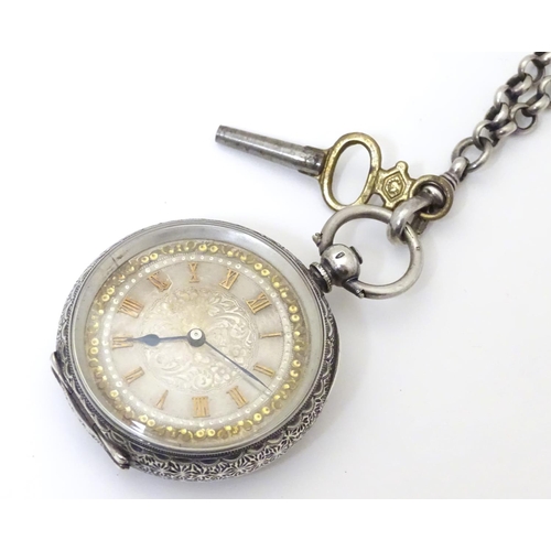 952 - A Continental silver cased pocket / fob watch the movement marked W & Co, Swiss made. Together with ... 