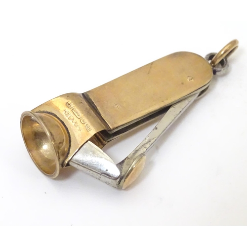 955A - A 9ct gold cheroot cutter, hallmarked Chester 1908, maker S. Blanckensee & Sons Ltd. Approx. 1 3/4