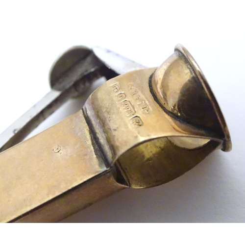 955A - A 9ct gold cheroot cutter, hallmarked Chester 1908, maker S. Blanckensee & Sons Ltd. Approx. 1 3/4