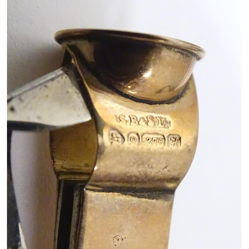 955A - A 9ct gold cheroot cutter, hallmarked Chester 1908, maker S. Blanckensee & Sons Ltd. Approx. 1 3/4