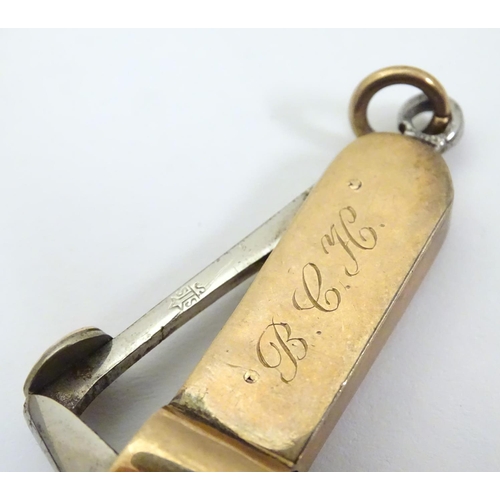 955A - A 9ct gold cheroot cutter, hallmarked Chester 1908, maker S. Blanckensee & Sons Ltd. Approx. 1 3/4