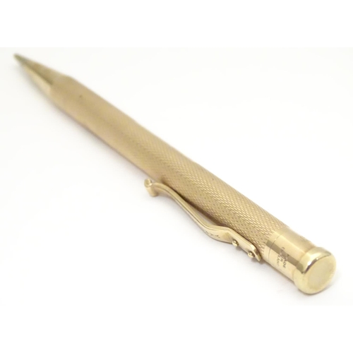 958 - A 9ct gold  Yard - O - Led pencil with engine turned decoration. marked Patent 422767 and hallmarked... 