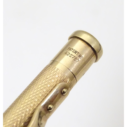 958 - A 9ct gold  Yard - O - Led pencil with engine turned decoration. marked Patent 422767 and hallmarked... 