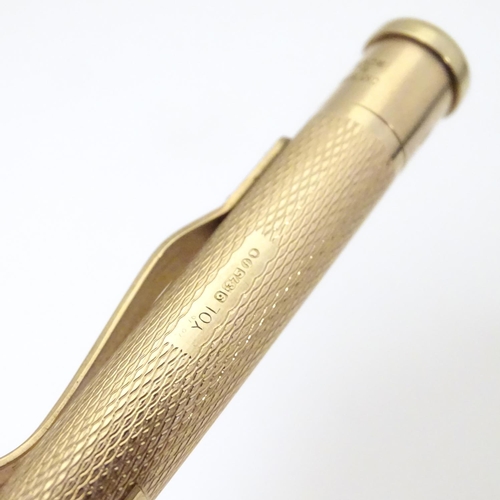 958 - A 9ct gold  Yard - O - Led pencil with engine turned decoration. marked Patent 422767 and hallmarked... 