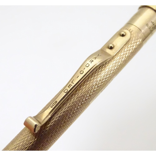 958 - A 9ct gold  Yard - O - Led pencil with engine turned decoration. marked Patent 422767 and hallmarked... 