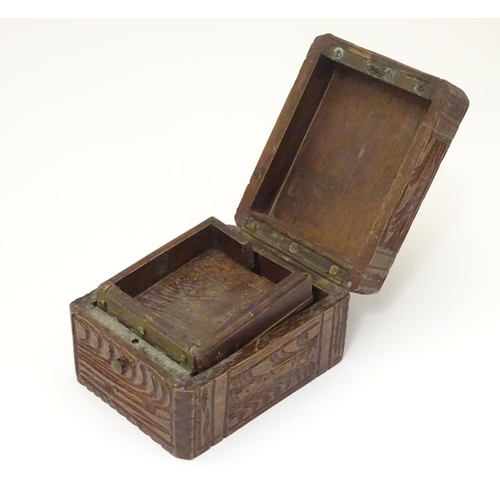 968 - A carved pocket watch travelling case / stand. Together with a pocket / fob watch. (2)