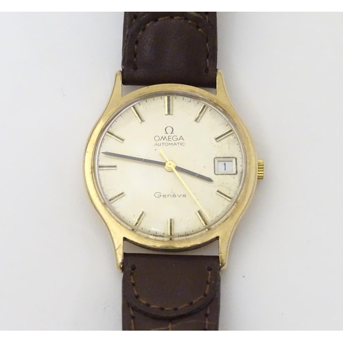 974 - A mid 20thC Omega Geneva automatic chronometer wrist watch with a 9ct gold case. The movement stampe... 