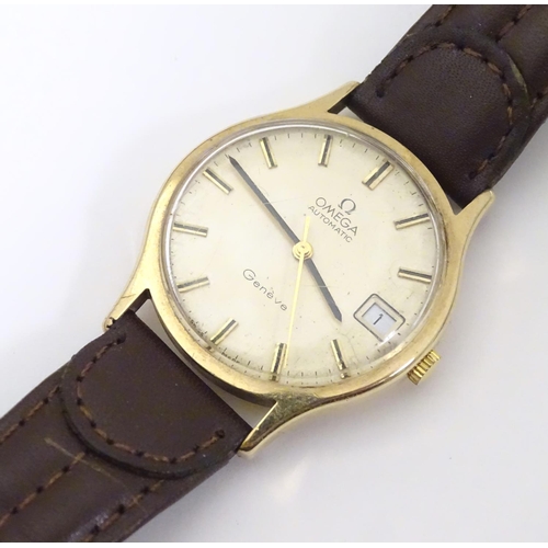 974 - A mid 20thC Omega Geneva automatic chronometer wrist watch with a 9ct gold case. The movement stampe... 