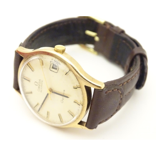 974 - A mid 20thC Omega Geneva automatic chronometer wrist watch with a 9ct gold case. The movement stampe... 