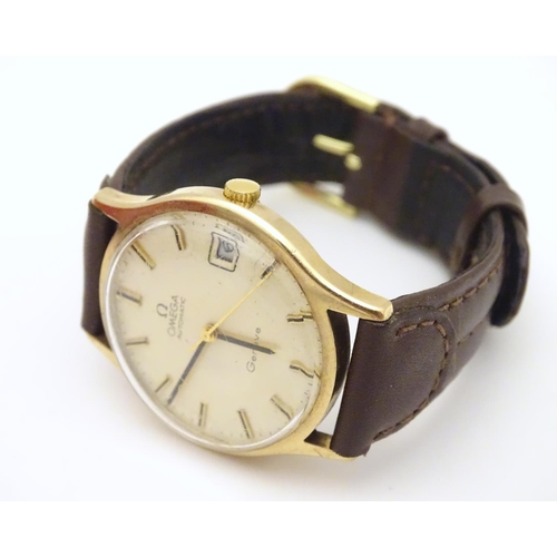 974 - A mid 20thC Omega Geneva automatic chronometer wrist watch with a 9ct gold case. The movement stampe... 