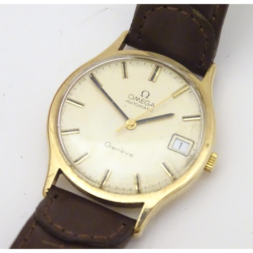 974 - A mid 20thC Omega Geneva automatic chronometer wrist watch with a 9ct gold case. The movement stampe... 