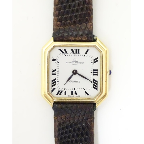 975 - A Baume & Mercier wrist watch, the 18ct gold case of squared canted form with 7/8