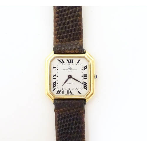 975 - A Baume & Mercier wrist watch, the 18ct gold case of squared canted form with 7/8