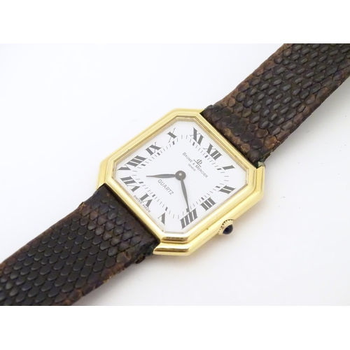 975 - A Baume & Mercier wrist watch, the 18ct gold case of squared canted form with 7/8