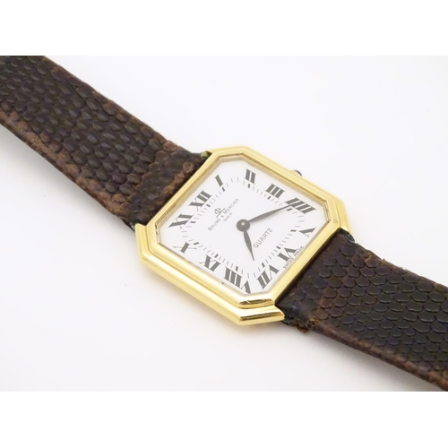 975 - A Baume & Mercier wrist watch, the 18ct gold case of squared canted form with 7/8