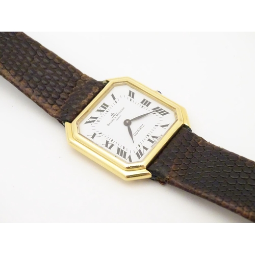 975 - A Baume & Mercier wrist watch, the 18ct gold case of squared canted form with 7/8