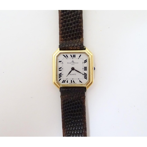 975 - A Baume & Mercier wrist watch, the 18ct gold case of squared canted form with 7/8