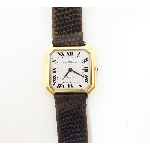 975 - A Baume & Mercier wrist watch, the 18ct gold case of squared canted form with 7/8