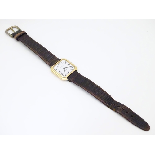 975 - A Baume & Mercier wrist watch, the 18ct gold case of squared canted form with 7/8