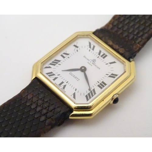 975 - A Baume & Mercier wrist watch, the 18ct gold case of squared canted form with 7/8