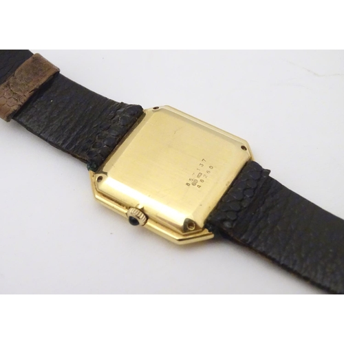 975 - A Baume & Mercier wrist watch, the 18ct gold case of squared canted form with 7/8