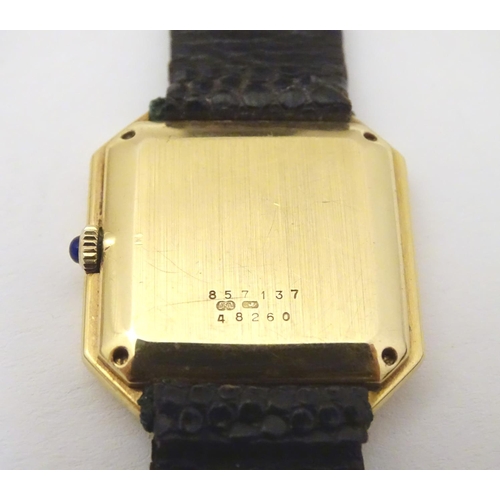 975 - A Baume & Mercier wrist watch, the 18ct gold case of squared canted form with 7/8