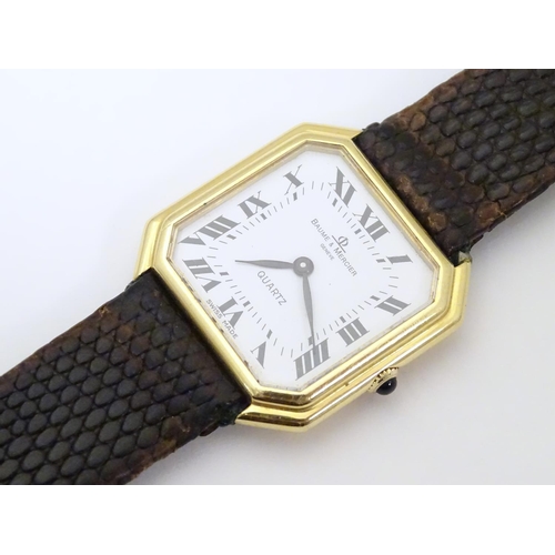 975 - A Baume & Mercier wrist watch, the 18ct gold case of squared canted form with 7/8