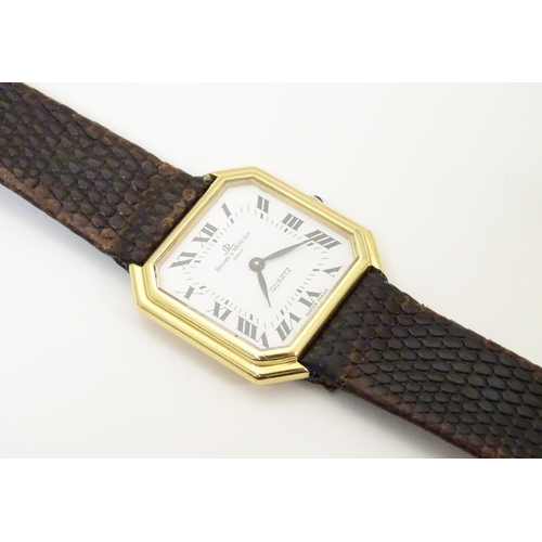 975 - A Baume & Mercier wrist watch, the 18ct gold case of squared canted form with 7/8