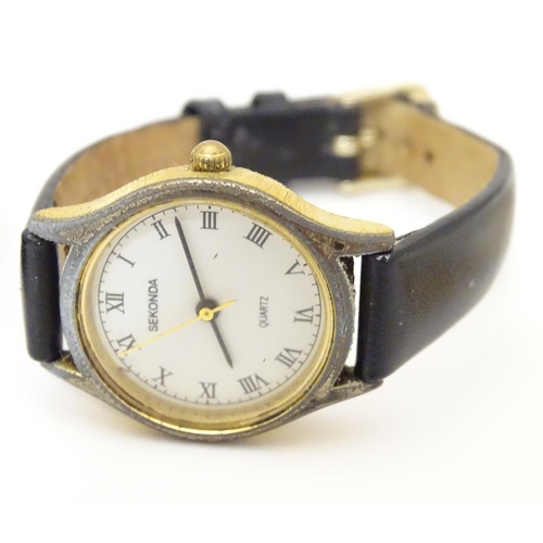 975A - Three various ladies wrist watches to include one with 9ct gold case, the dial signed Limit. Togethe... 