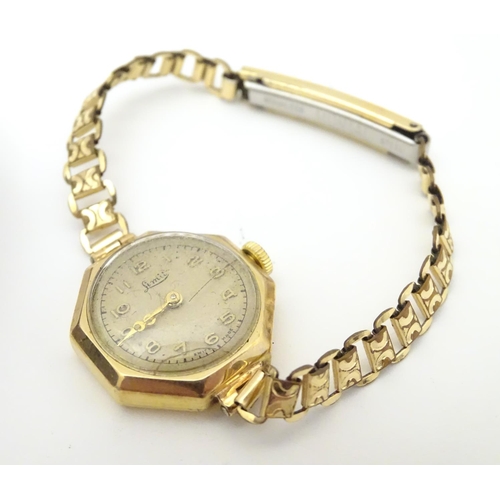 975A - Three various ladies wrist watches to include one with 9ct gold case, the dial signed Limit. Togethe... 