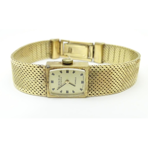 978A - A ladies 9ct gold wrist watch with enamel dial, the case stamped D&R 20152, dial approx. 3/4