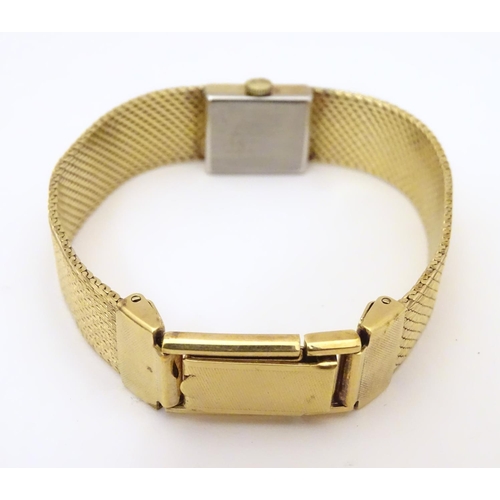 978A - A ladies 9ct gold wrist watch with enamel dial, the case stamped D&R 20152, dial approx. 3/4