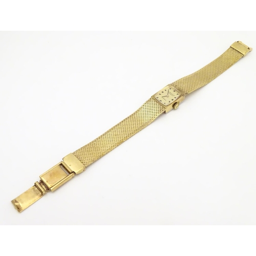 978A - A ladies 9ct gold wrist watch with enamel dial, the case stamped D&R 20152, dial approx. 3/4