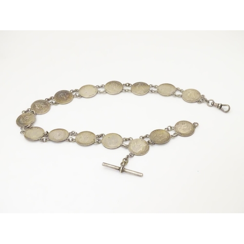 980 - An early 20thC white metal watch chain, linked by fifteen Victorian and Edwardian 3d threepenny coin... 