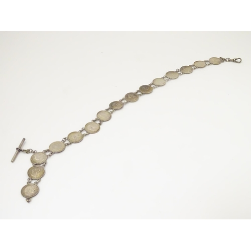 980 - An early 20thC white metal watch chain, linked by fifteen Victorian and Edwardian 3d threepenny coin... 