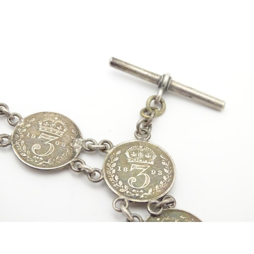 980 - An early 20thC white metal watch chain, linked by fifteen Victorian and Edwardian 3d threepenny coin... 