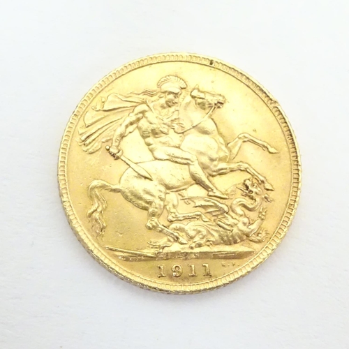 981 - Coin : A 1911 George V gold sovereign.