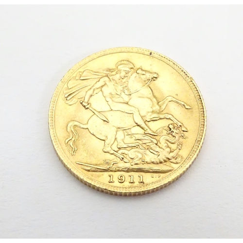 981 - Coin : A 1911 George V gold sovereign.