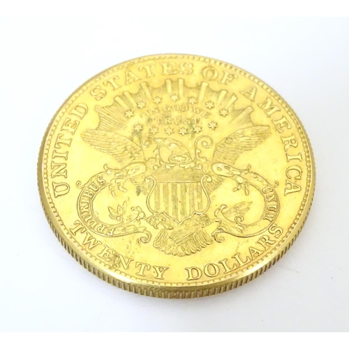 983 - Coin: An American gold 1896 twenty / 20 dollar coin. Approx. 1 3/8