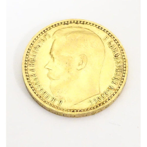 984 - Coin: A gold 1897 fifteen / 15 rouble coin, depicting a portrait of the Emperor Nikolai II. Approx. ... 