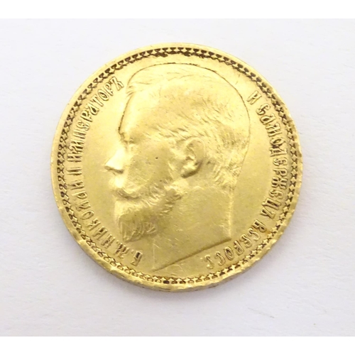 984 - Coin: A gold 1897 fifteen / 15 rouble coin, depicting a portrait of the Emperor Nikolai II. Approx. ... 