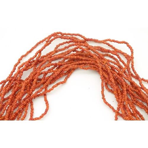 945 - A graduated bead necklace of facet cut amber coloured beads Approx 32