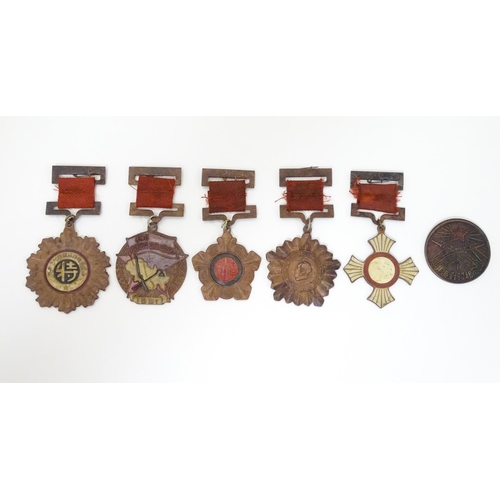 1013 - Militaria: a mid 20thC Chinese PLA medal group, comprising five copper medals and a badge (6)