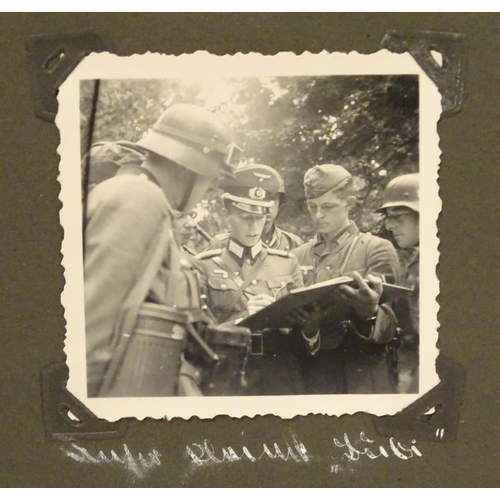 1038 - Militaria: a WWII / World War 2 / Second World War German soldier's photograph album, entitled ' 2. ... 