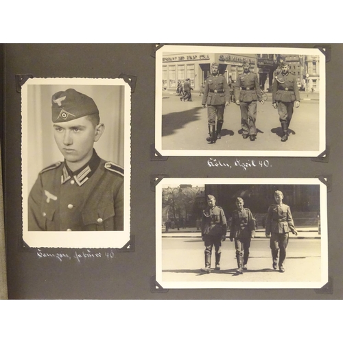 1038 - Militaria: a WWII / World War 2 / Second World War German soldier's photograph album, entitled ' 2. ... 