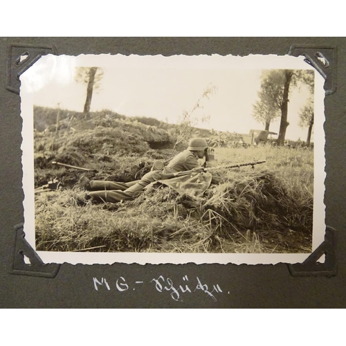 1038 - Militaria: a WWII / World War 2 / Second World War German soldier's photograph album, entitled ' 2. ... 