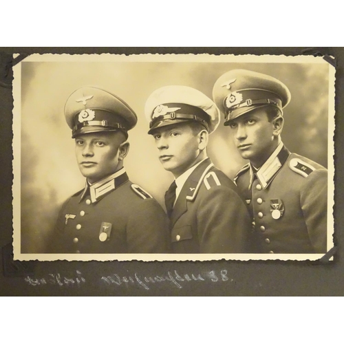 1038 - Militaria: a WWII / World War 2 / Second World War German soldier's photograph album, entitled ' 2. ... 